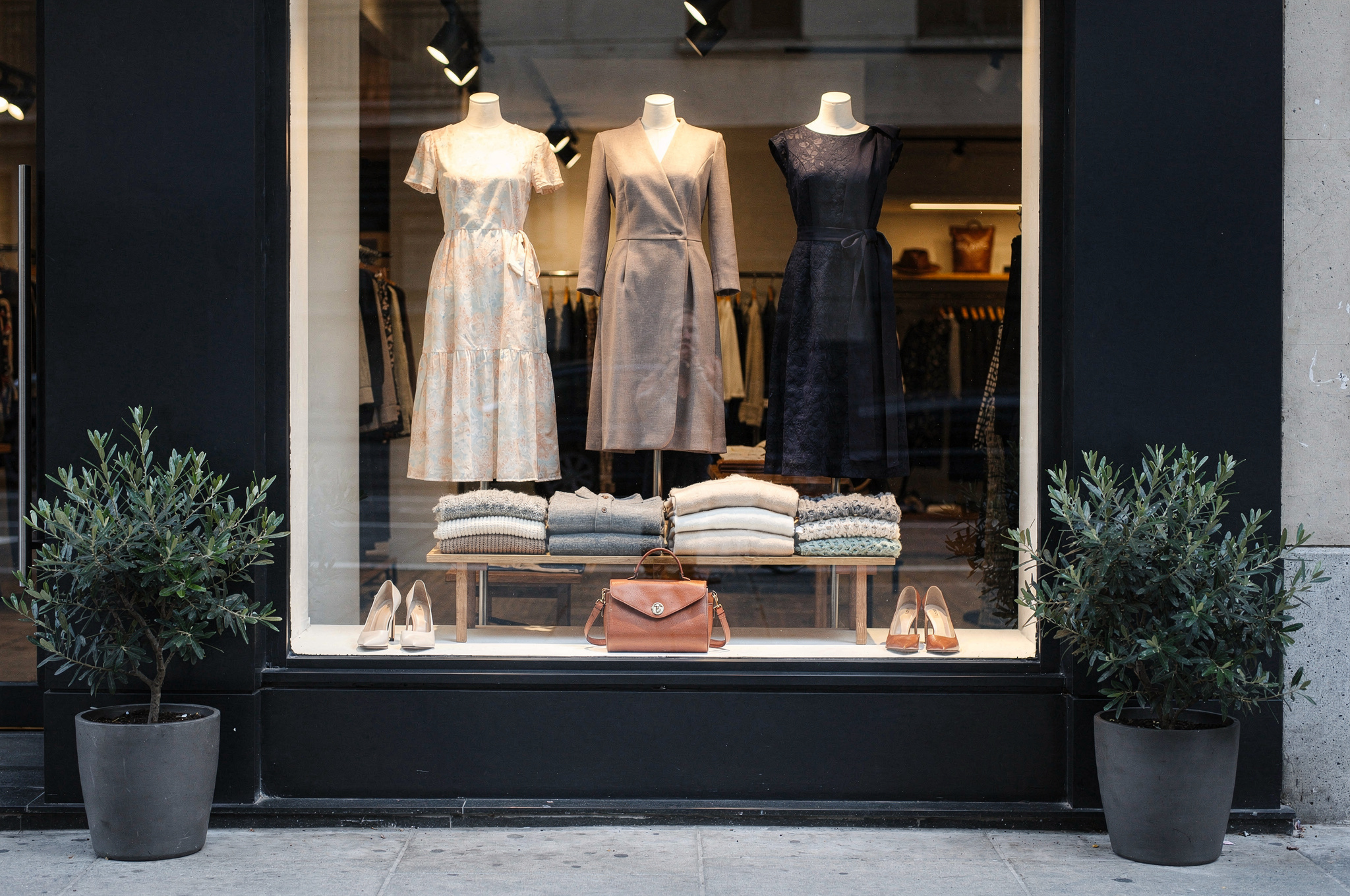 boutique clothing store window display with dresses and accessories