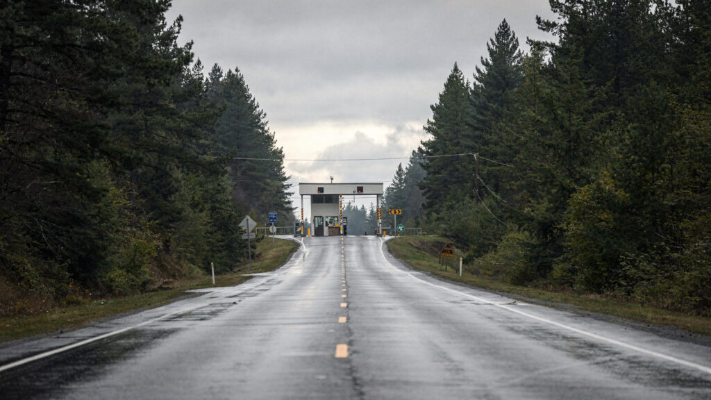 Rural road approaching the Point Roberts border crossing station near Delta BC