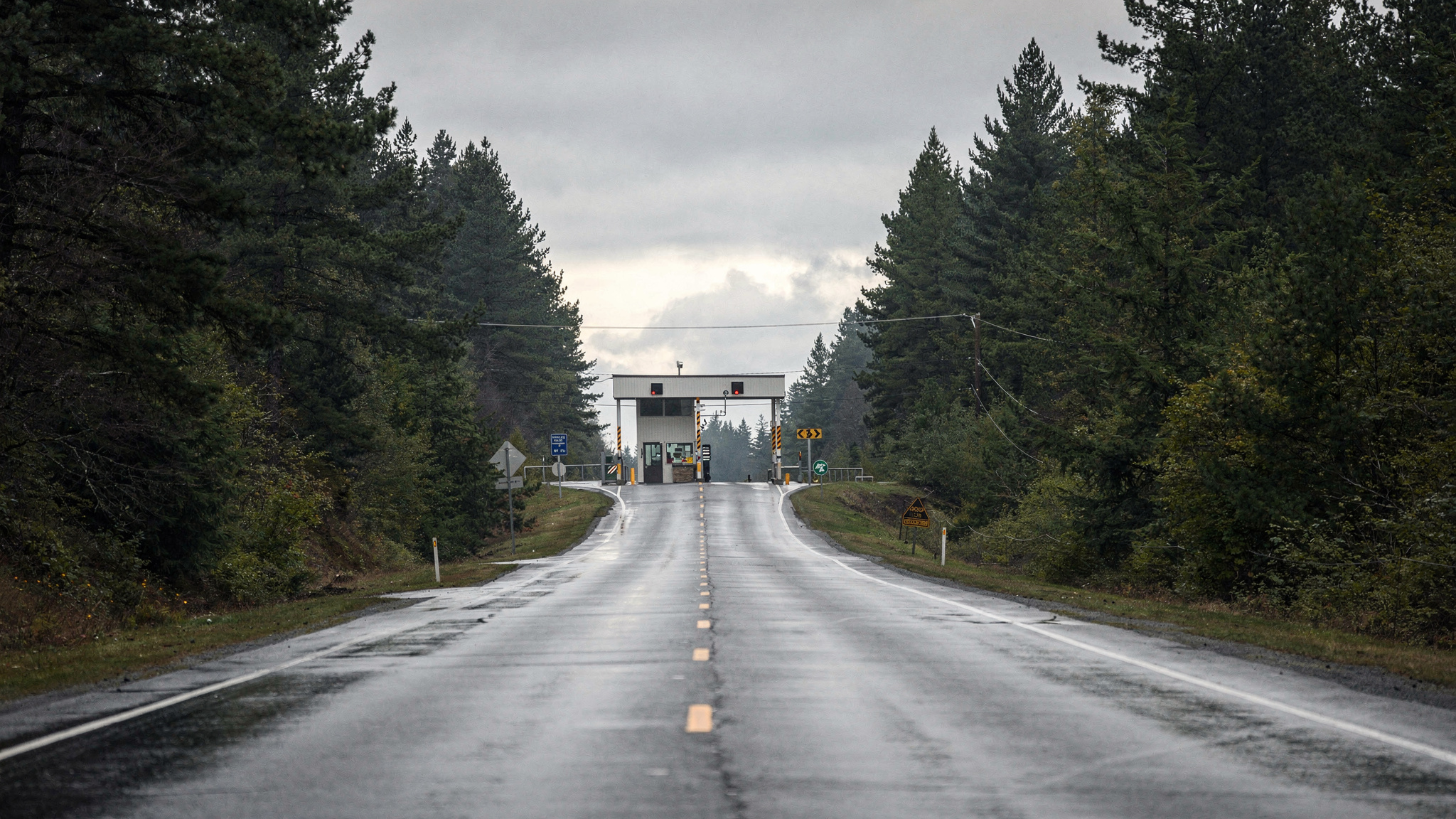 Rural road approaching the Point Roberts border crossing station near Delta BC